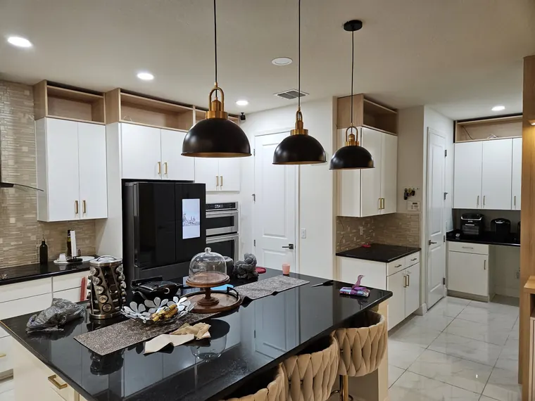 White kitchen with black island